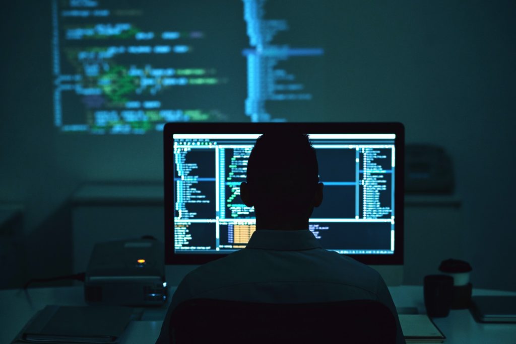 IT engineer monitoring critical infrastructure at night — Virtualtek expert support